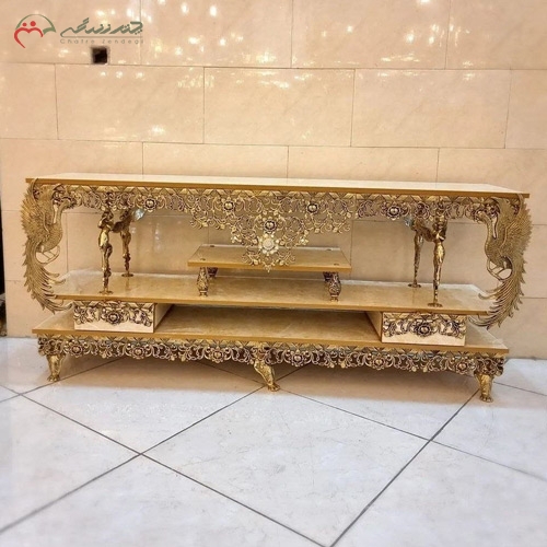 خرید، قیمت و مشخصات میز تلویزیون تمام برنجی با ام دی اف هایگلس، لوکس و مدرن، مدل فرشته بالدار و گل سرخ زیر قیمت | چترزندگی