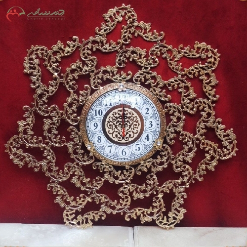 خرید، قیمت و مشخصات ساعت دیواری مدل گل قمی بدنه تمام برنجی و طراحی شیک و ساده - چترزندگی
