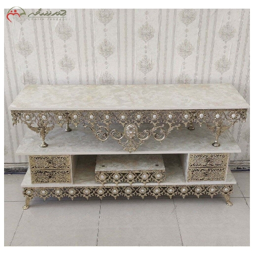 خرید، قیمت و مشخصات میز تلویزیون برنزی بدنه ظریف کاری شده ی طرح آفتابگردان تاج دار سنگین، 4 کشو با گارانتی - چترزندگی