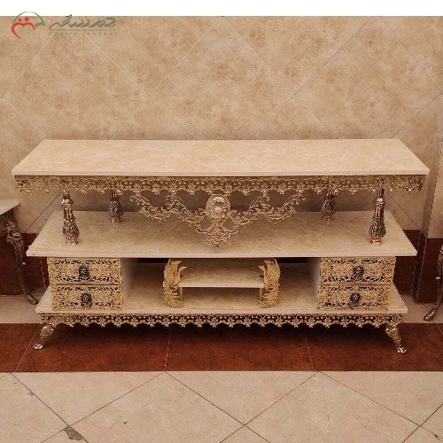 خرید، قیمت و مشخصات میز تلویزیون برنزی رنگ آبکاری شده با رویه هایگلس و بدنه ی طرح گل نقلی دارای ضمانت رنگ - چترزندگی