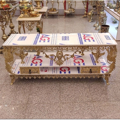 خرید، قیمت و مشخصات میز تلویزیون تمام برنزی مدل گل نقلی با حاشیه های طاووس دار و قیمت عالی - چترزندگی