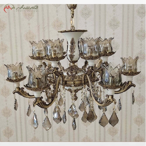 خرید، قیمت و مشخصات لوستر برنزی 12 شعله با رنگ آنتیک چند لایه، با خمکاری های زیبا در شاخه ها و رنگ ثابت بدنه - چترزندگی