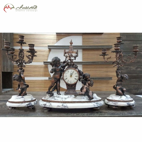 خرید، قیمت و مشخصات ست ساعت و شمعدان برنزی به رنگ آنتیک و سنگ سفید کار شده در پایه هابا طراحی ظریف کد 434 - چترزندگی