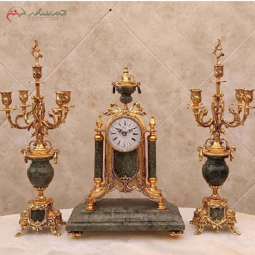 خرید، قیمت و مشخصات ست ساعت رومیزی و شمعدان با بدنه ی برنزی طرح آریانا و رنگ آبکاری شده ی فورتیک با ضمانت کد 411 - چترزندگی