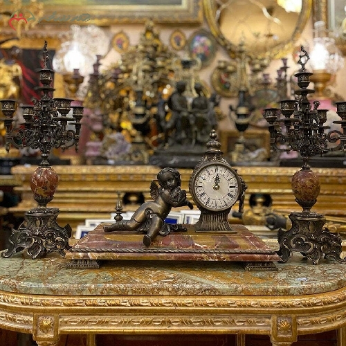 خرید، قیمت و مشخصات ساعت و شمعدان برنزی به رنگ طلایی فورتیک طرح بچه، طراحی و تولید با دقت و ظرافت بالا کد 440 - چترزندگی