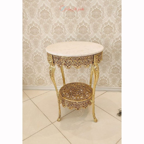 خرید آنلاین، میز خاطره گرد 2 طبقه، دارای 4 پایه شکیل، کفی مشبک جنس آلیاژ آلومنیوم با آبکاری برنز میز خاطره گرد 2 طبقه با کفی مشبک ساخته شده با آلیاژ آلومنیوم اعلاء، آبکاری برنز رنگ ثابت، عرض 