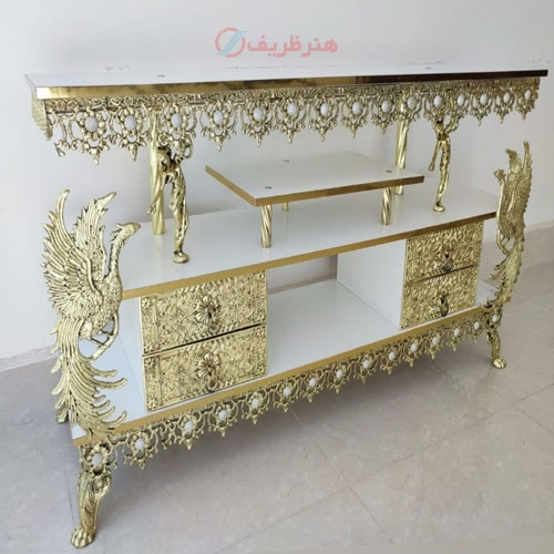 خرید آنلاین، میز تلویزیون جنس آلیاژ آلومنیوم با آبکاری برنز در طرح 2 ملکه، دارای 4 کشو، زیر قیمت بازار | چترزندگی