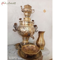خرید آنلاین، سرویس 5 پارچه سماور ذغالی برنجی 6 لیتری در طرح شیر، قلم زنی اعلاء با ضمانت، زیر قیم بازار | هنرظریف